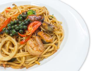 Spaghetti spicy with seafood on a white plate