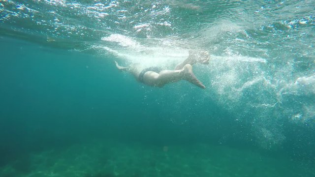 swimmer swims into the sea, raw, 4K