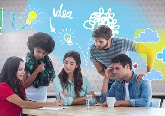 Group of friends sitting in front of idea doodles