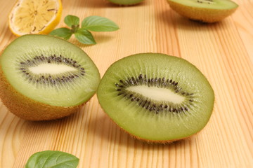 Fototapeta premium Kiwi on a wooden background