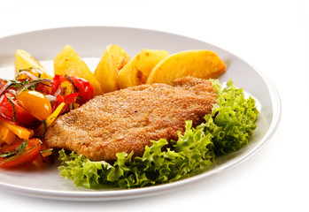 Pork chop, French fries and vegetables 