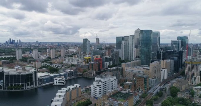 Aerial panning view of the Millwall outer dock from the financial district of the Docklands to the skyline of central London