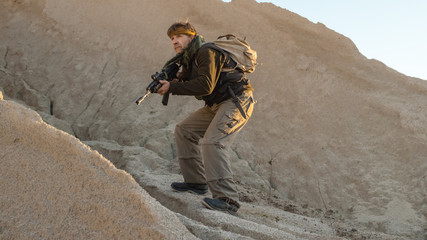 Armed Terrorist Walking in Desert Environment