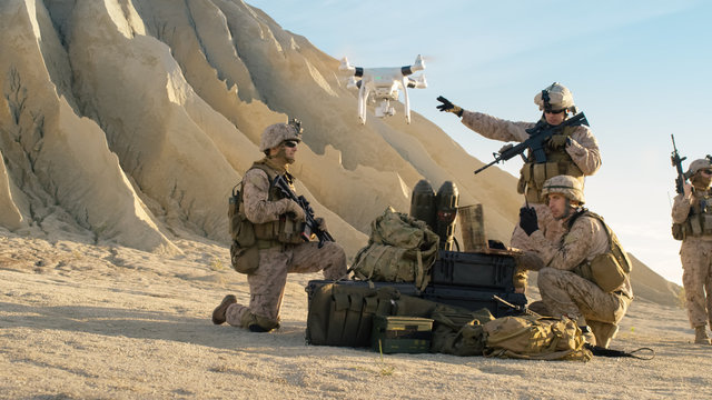 Soldiers are Using Drone for Scouting During Military Operation in the Desert.