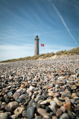 Fototapeta na wymiar The lighthouse on Grenen beach near Skagen in Denmark