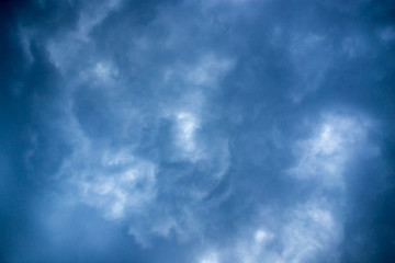 Beautiful clouds at sunset after rain as background .