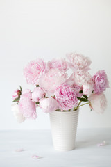 beautiful pink peony flowers bouquet in vase © Olga Miltsova