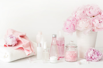 bath and spa with peony flowers beauty products towels