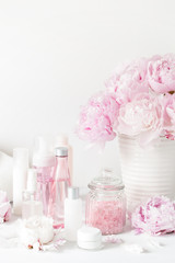 Obraz na płótnie Canvas bath and spa with peony flowers beauty products towels
