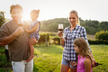 Fototapeta premium Winemaker family together in vineyard