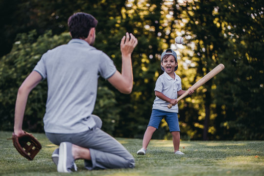 Dad With Son Playing Baseball