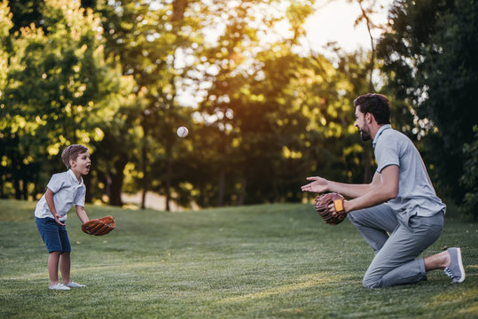 Dad With Son Playing Baseball