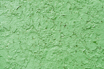 Peeling green paint on the metal surface covered with rust texture. Copy space ready for your background design. Craquelure