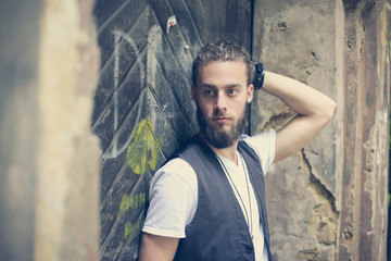 Close-up shot of young handsome hippie man. Space for copy.