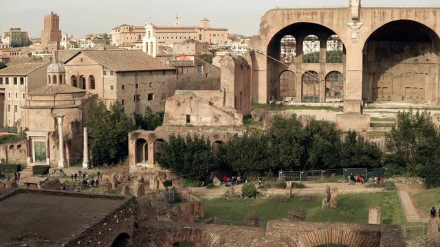 Vibrant panorama of Rome in Italy includes a wide range of ancient buildings, Arch of Titus, Colosseum on the background
