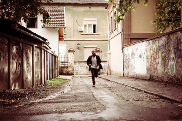Fototapeta na wymiar Businessman running. Man running on the street.