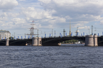 View of the Exchange Bridge from the Makarov Embankment on a Summer Sunny Day in St. Petersburg, Russia