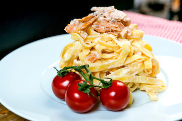 tasty pasta with salmon on a the table