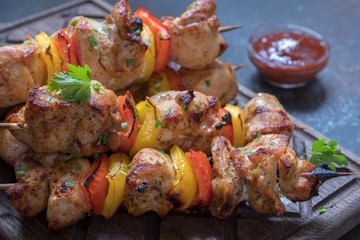 Grilled pork kebab with red and yellow pepper