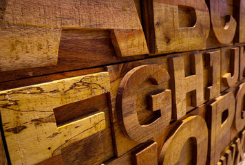 Brown wooden abc letters closeup. Alphabet letters on the wooden board. Typography concept background.