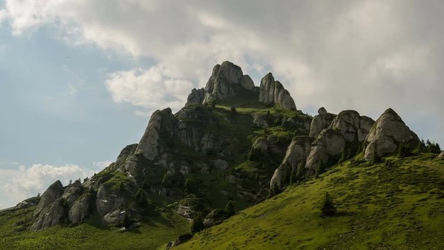 4 k timelapse of fast moving cloud shadows, white clouds and blue sky in Ciucas Mountains, Romania.