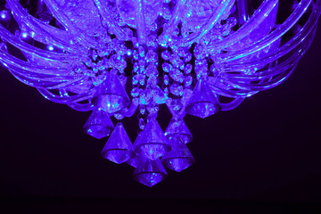 Beautiful glamour glass crystal chandelier closeup. Expensive classical luxury interior concept.