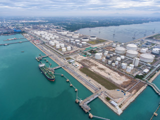 Oil refinery with a background of the sea and sky.The factory is located in the middle of nature and no emissions. The area around the air pure.business logistic.Aerial view .