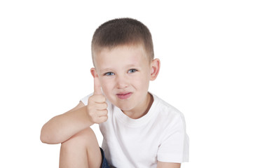 happy little boy showing thumbs up isolated on white