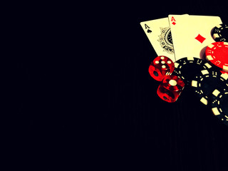 Black colours of poker game concept.  Plot with bones, chips and cards