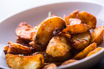 Potato. Roasted potatoes. American potatoes with salt rosemary and cumin. Roasted potato wedges delicious crispy