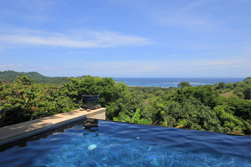 Infinity pool of a luxury house with view of the rainforest and beach, Costa Rica, Central America