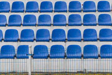 Naklejka premium blue rows of seats on the stadium