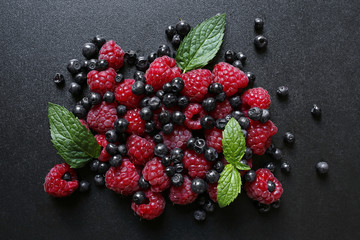 fresh summer fruits on black background