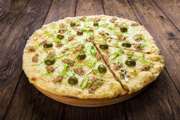 Delicious seafood pizza with tuna and olives