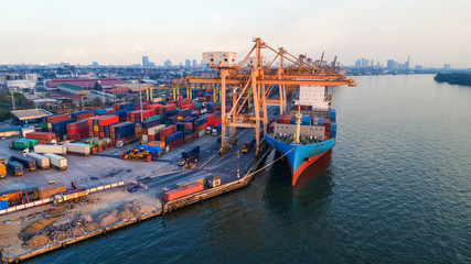 container ship in import export and business logistic.By crane ,Trade Port , Shipping.cargo to...