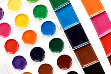 New children's watercolor colorful paints isolated on white