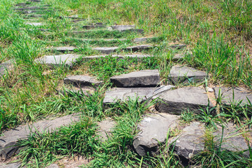 Old stone stairs. Vintage natural pathway.