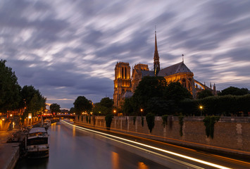 view on Seine river and Notre-Dame de Paris Cathedral at night