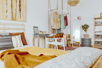 Bed with pillows and blanket