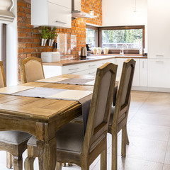 Vintage wooden table in stylish kitchen
