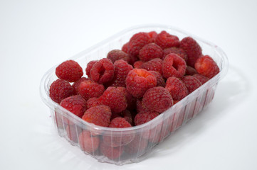 Raspberry in a bowl on a white background