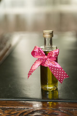 Lovely decorated chrism bottle at romanian Christening ceremony