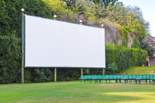 Outdoor cinema with white projection screen