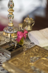 Lovely decorated chrism bottle at romanian Christening ceremony