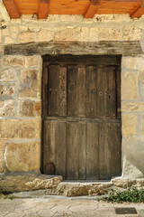 medieval door in the town of Orbaneja of the Castle in the province of Burgos in Castile and Leon, Spain