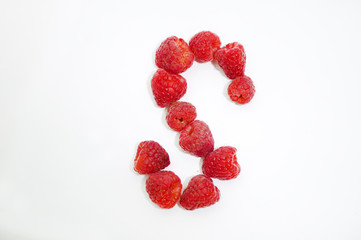 Alphabetical letter S made of raspberries on a white background