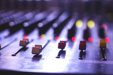 Closeup of a microphone button control system engineering professionals. Bokeh background.