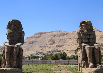 The Colossi of Memnon. Two massive stone statues of the Pharaoh Amenhotep III.