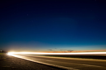 Fototapeta premium Photo of country road with traces of light vehicles