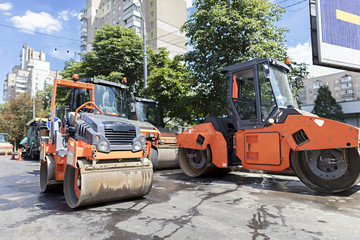 Five heavy road vibrating roller seals ready for road repair in a modern city